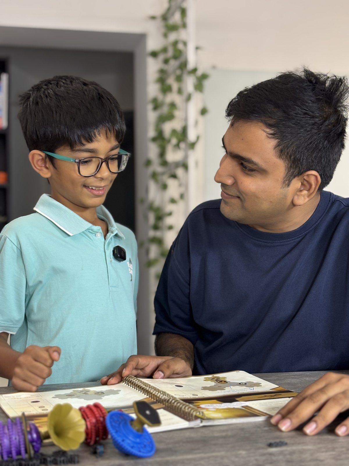 A Cubo Academy child and their parent looking at a build together